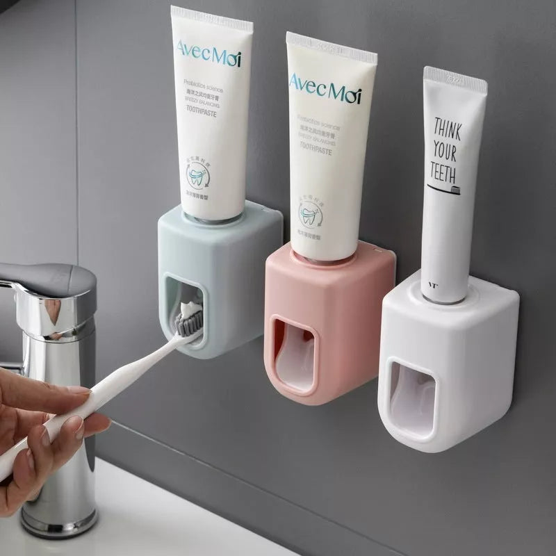 Nordic Automatic Toothpaste Dispenser in pink, blue, white, and gray options