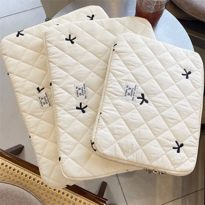 Nylon notebook storage bag with rhombus embroidery and bow, shown in light blue colour.