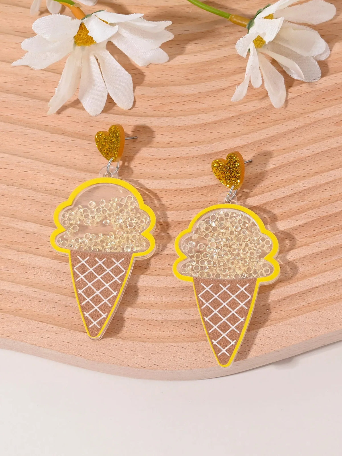 Colourful acrylic earrings with fruit and dessert designs including cherry, strawberry, watermelon, pineapple, coconut, cake and ice cream motifs
