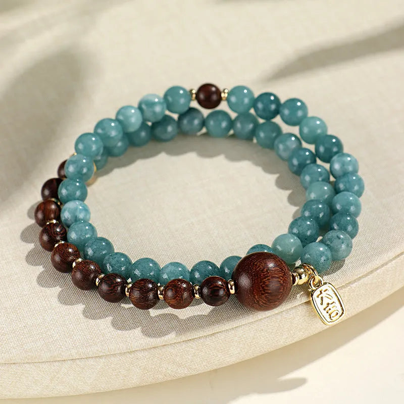 Natural stone blue women's beaded bracelet with geometric shapes and Chinese Fu and Xi characters.