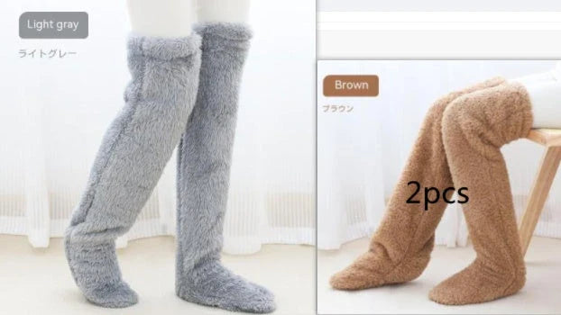Cozy over-the-knee fuzzy socks in various colors, including brown, blue, dark gray, pink, silver, and more. Comfortable cotton design for warm, snug legs.
