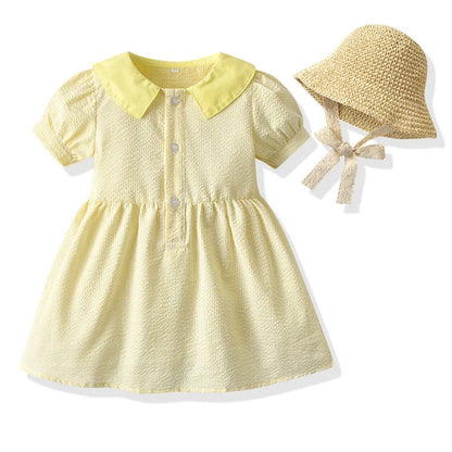 Girl wearing yellow plaid princess cotton dress with matching lace straw hat summer set