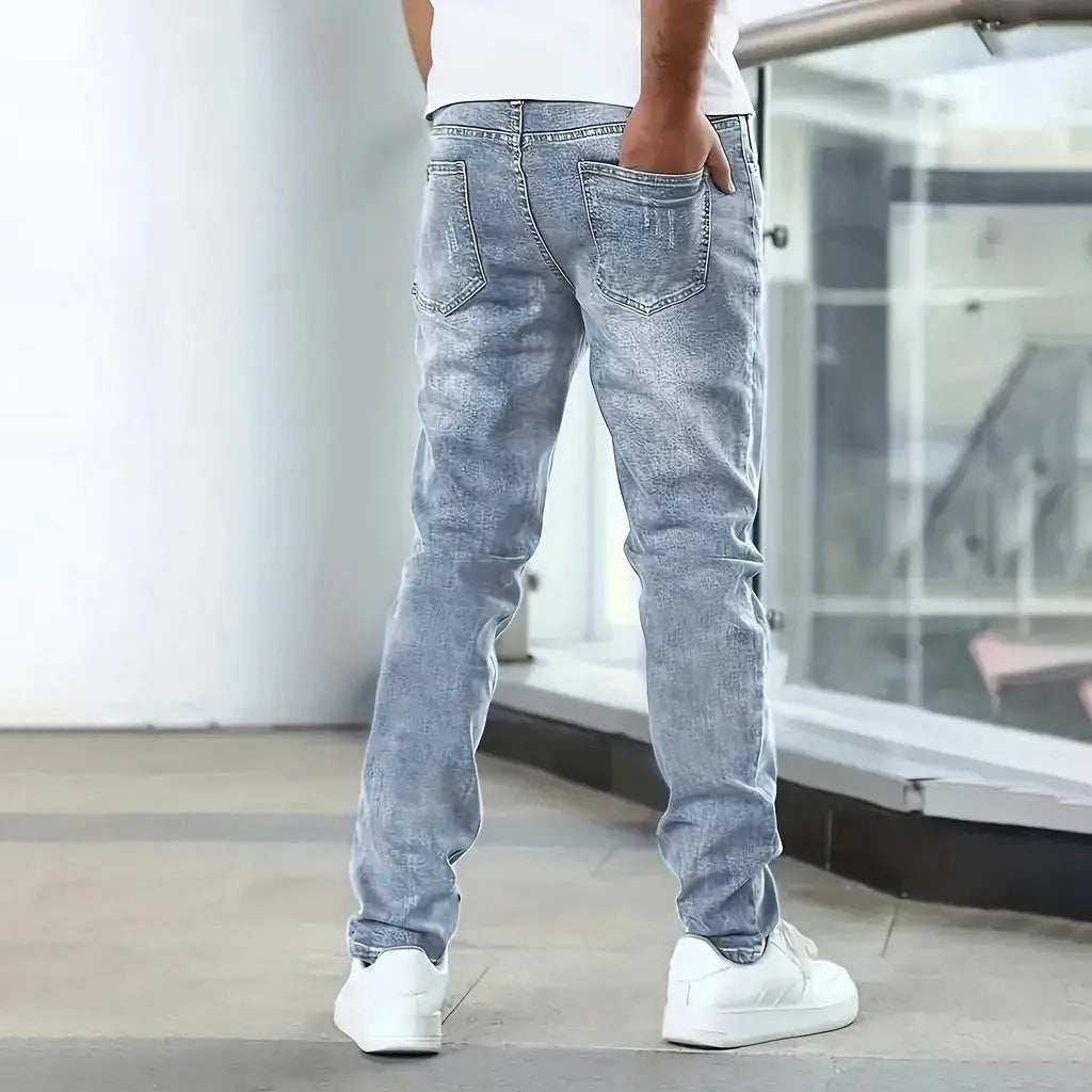 Men's black stretch jeans with straight leg skinny fit showing zipper fly and mid-rise waist