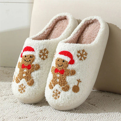 Cozy plush gingerbread slippers with festive snowflake patterns, designed for comfortable indoor wear during the winter season.