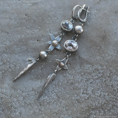 Pair of long antique silver geometric XINGX pendant earrings with rhinestone details on alloy posts.