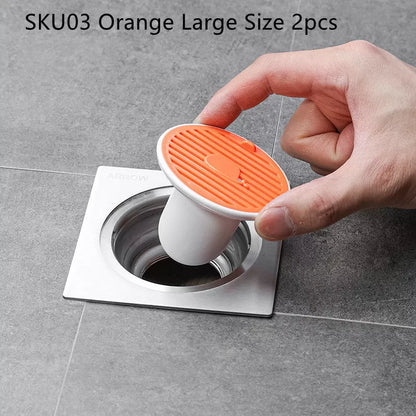 Whale Magnetic Suction Floor Drain Cover in white, orange, or green, blocking sewer odors with a tight seal