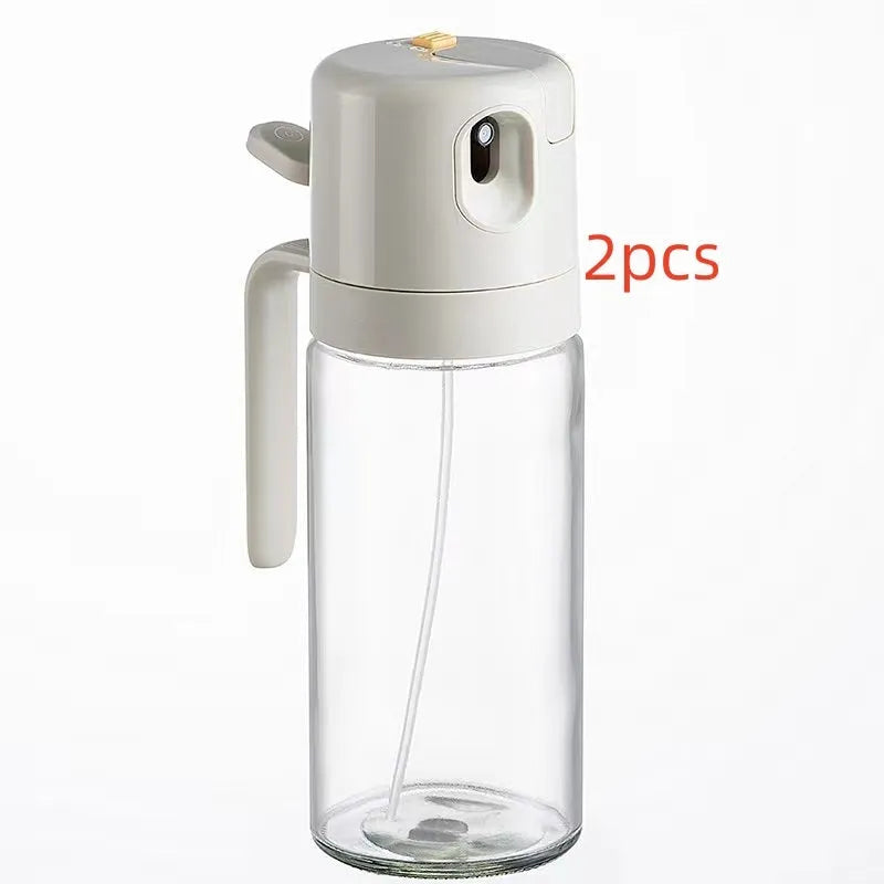 Warm grey 550ml glass oil sprayer bottle with dual-mode cap for spraying and pouring.