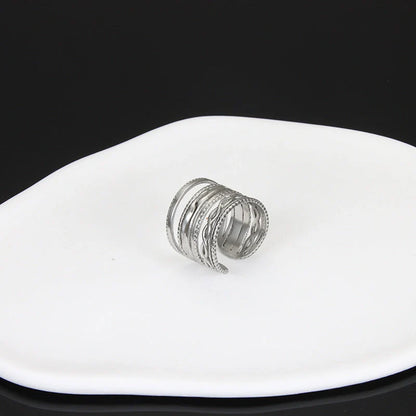 Adjustable stainless steel finger ring with unique charm designs in various colors