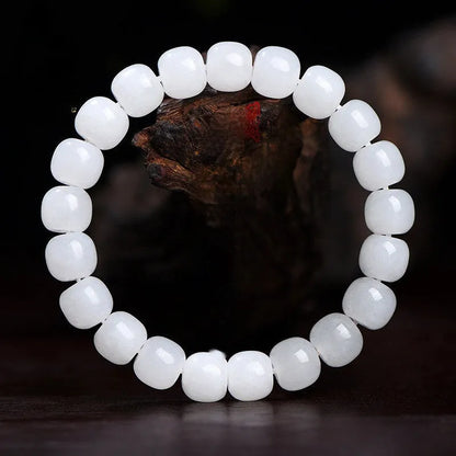 White jade barrel beads bracelet on wrist, showing Hetian jade stones in casual unisex design