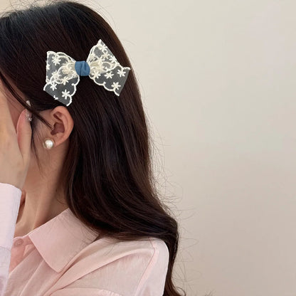 Cloth barrette hairpin set showing blue bow, beige lace, and pearl butterfly designs