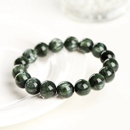 Green Dragon Crystal bracelet with 8-9mm geometry beads and Ruyi elements on wrist