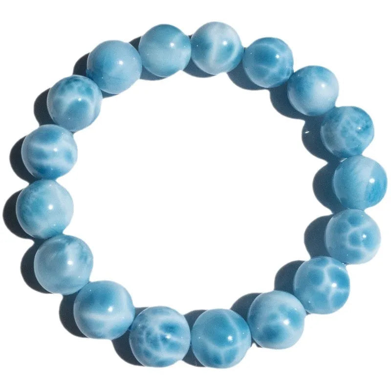 Blue bodhi bracelet with pearl accents showing bead sizes from 6mm to 14mm in Maillard style design