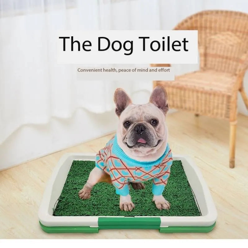 Green synthetic grass indoor dog toilet tray with plastic base for puppy training.