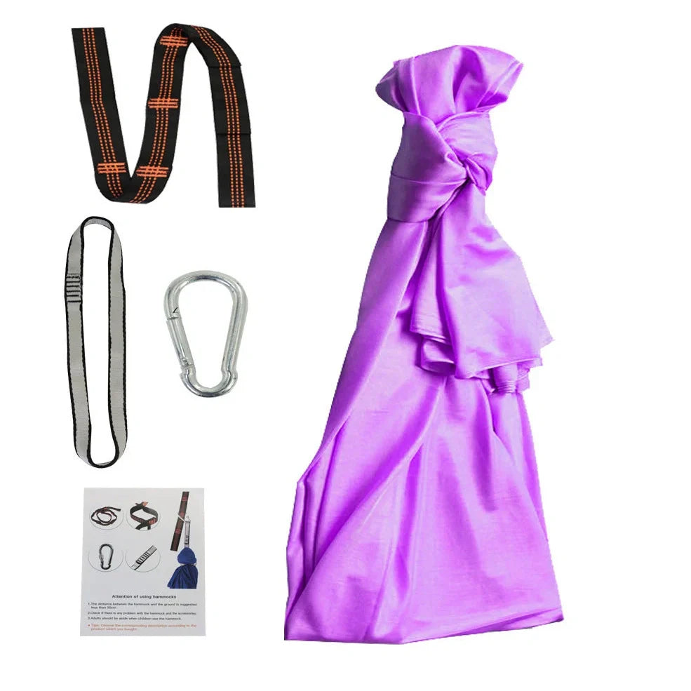 Child in black therapy swing cocoon with multi-loop daisy chain height adjustment system