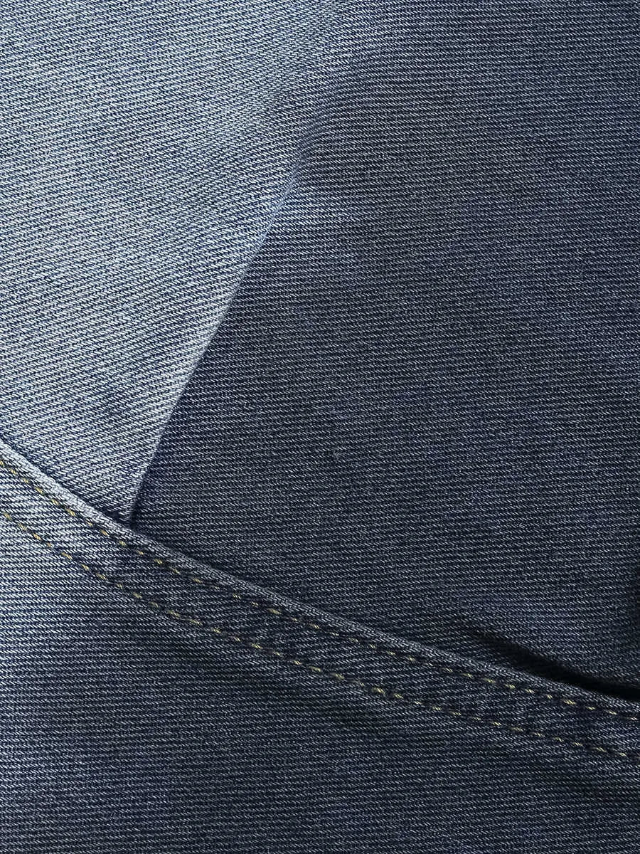 Blue women's cropped jeans with a loose fit, tie-dye gradient pattern, and distressed wash.