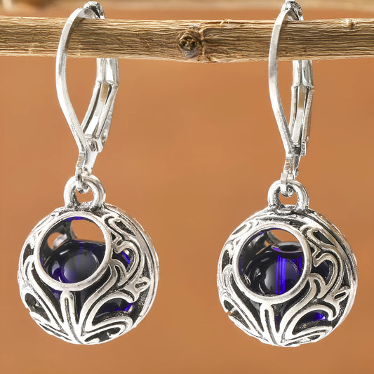 Geometric silver zinc alloy earrings with blue gemstone pendant and vintage engraving detail
