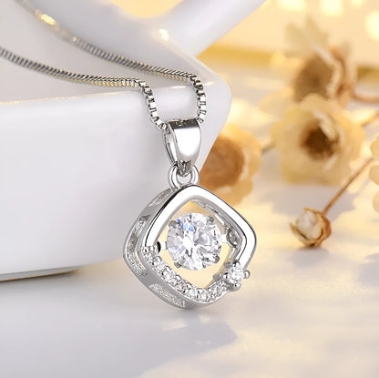 Sterling silver heart-shaped pendant necklace with a small crown and bow design, shown in a rose gold finish.