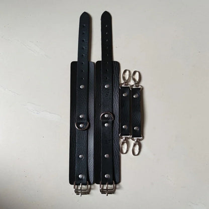 Black leather BDSM harness set showing adjustable 1.5cm width and four-piece coordinated design
