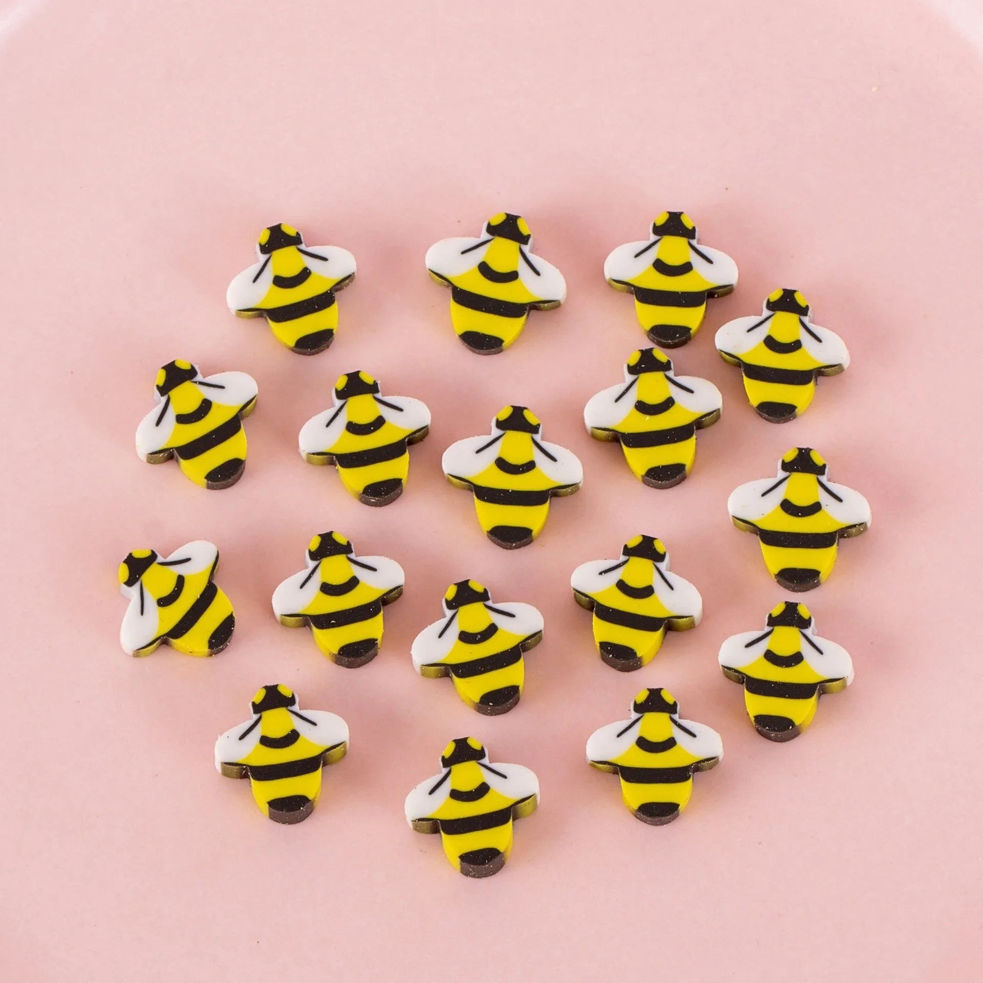 Assortment of 50 small cartoon erasers in pearlescent bags, showing fruit, animal, and holiday designs.