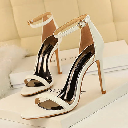 Women's open toe high heels with an ankle strap buckle in six colour options on a white background.