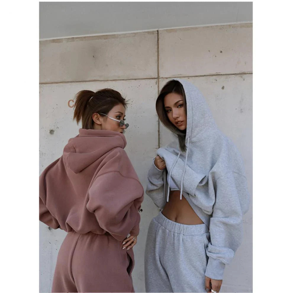 Women's casual hoodie outfit in various colors and sizes, featuring a stylish design and comfortable polyester construction.