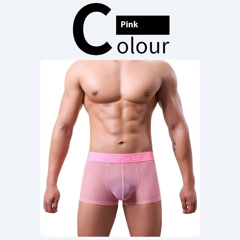 Men's thin solid colour boxer shorts in black, laid flat to show knit texture and seamless design