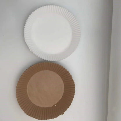 Disposable air fryer liners made of durable, food-grade parchment paper for effortless cleanup and healthy cooking