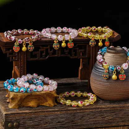 Handmade glass bracelet with 10mm swallowing gold beast cherry blossom heart charm in six colour options