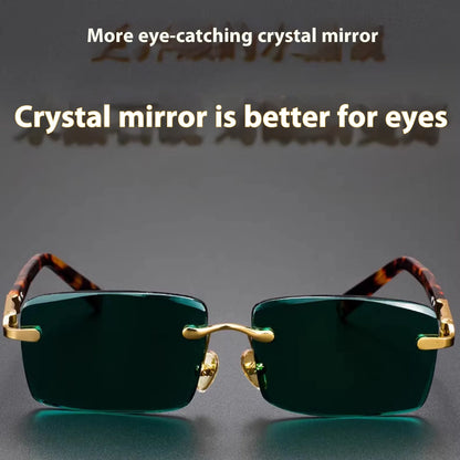 Dark green frameless crystal glasses with sunshade lenses, case, and cloth