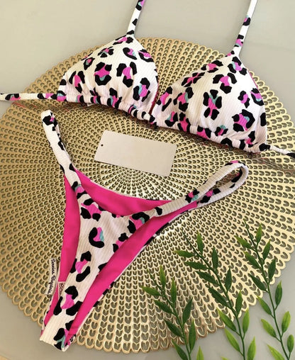 Women's printed bikini swimsuit with briefs style and cotton lining on a mannequin.