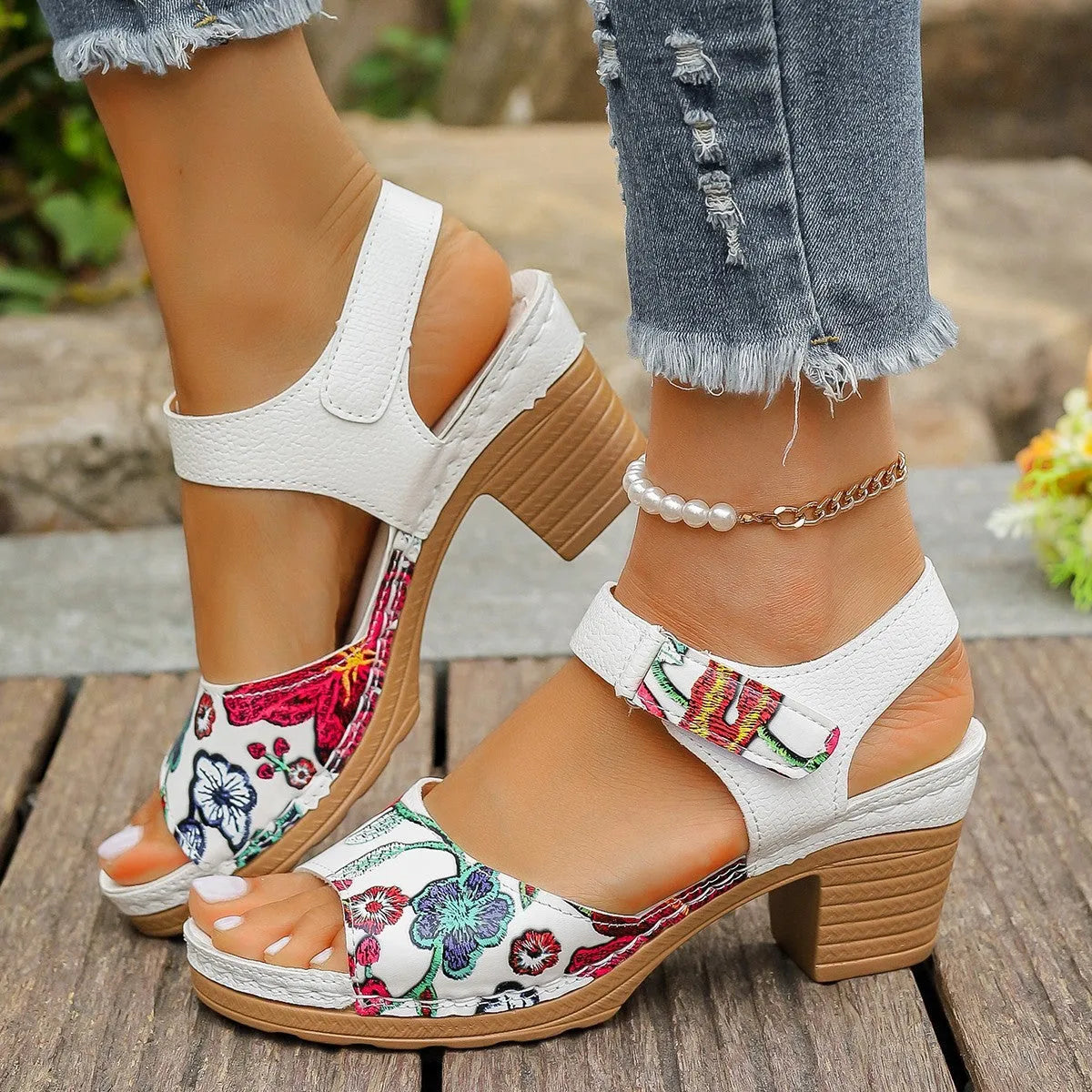 White women's high heel sandals with velcro buckle closure showing PU upper and rubber sole