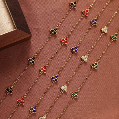 Women's stainless steel bracelet with three triangle-shaped charms in different coloured stone settings