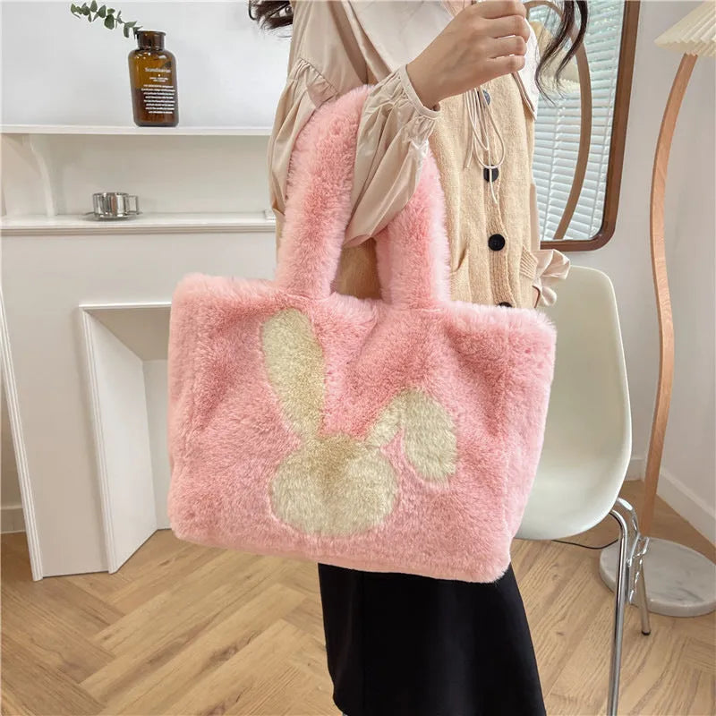 Cute cartoon rabbit ears design on a soft plush large capacity shoulder tote bag.