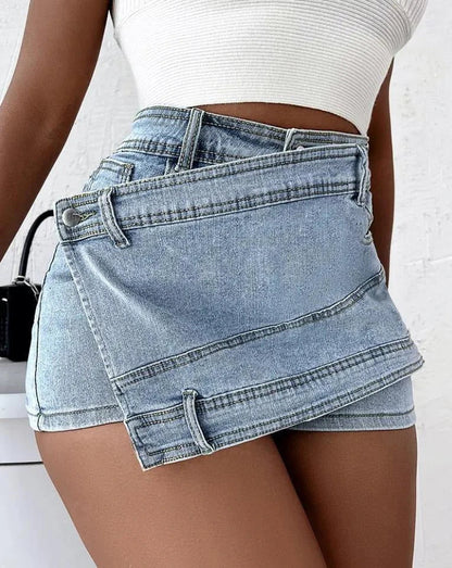 Stylish Y2K-inspired denim shorts with an asymmetrical hemline, high-waist design, and stretch fabric for a flattering fit