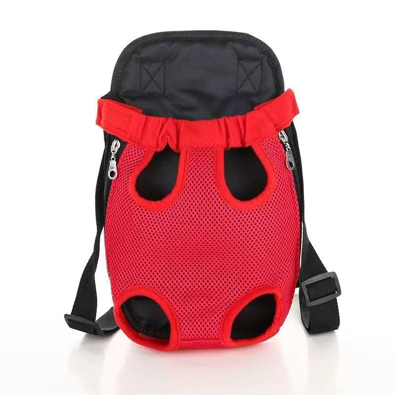 A small dog in a front-worn nylon carrier backpack with mesh panels, adjustable straps and side zips.