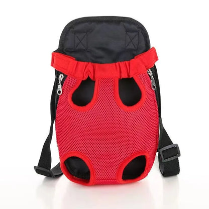 A small dog in a front-worn nylon carrier backpack with mesh panels, adjustable straps and side zips.