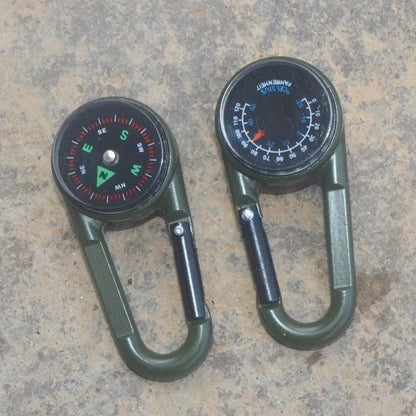 Black outdoor carabiner with a built-in circular compass and thermometer display on its side.