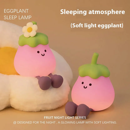 Cartoon eggplant shaped night lamp emitting soft yellow light, showing compact dimensions