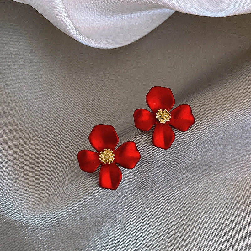 Silver-tone earrings with delicate red petal design, perfect for adding a touch of Korean-inspired elegance to any outfit.