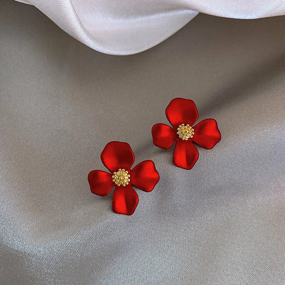 Silver-tone earrings with delicate red petal design, perfect for adding a touch of Korean-inspired elegance to any outfit.