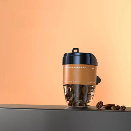 Brown plastic coffee cup-shaped solid car air freshener for dashboard odour removal.