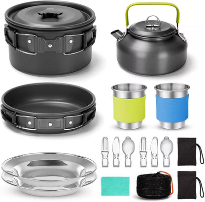 Camping cooker set with teapot, frying pan, and stainless steel utensils for outdoor dining