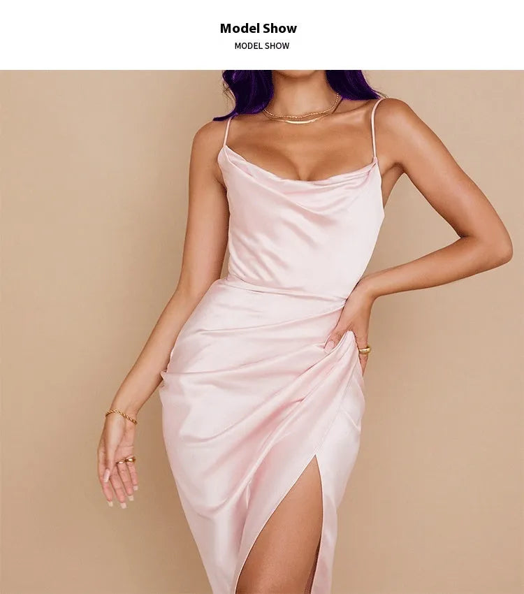 A woman wearing a satin high-waisted midi skirt in a solid colour, showcasing the sleeveless one-step design.