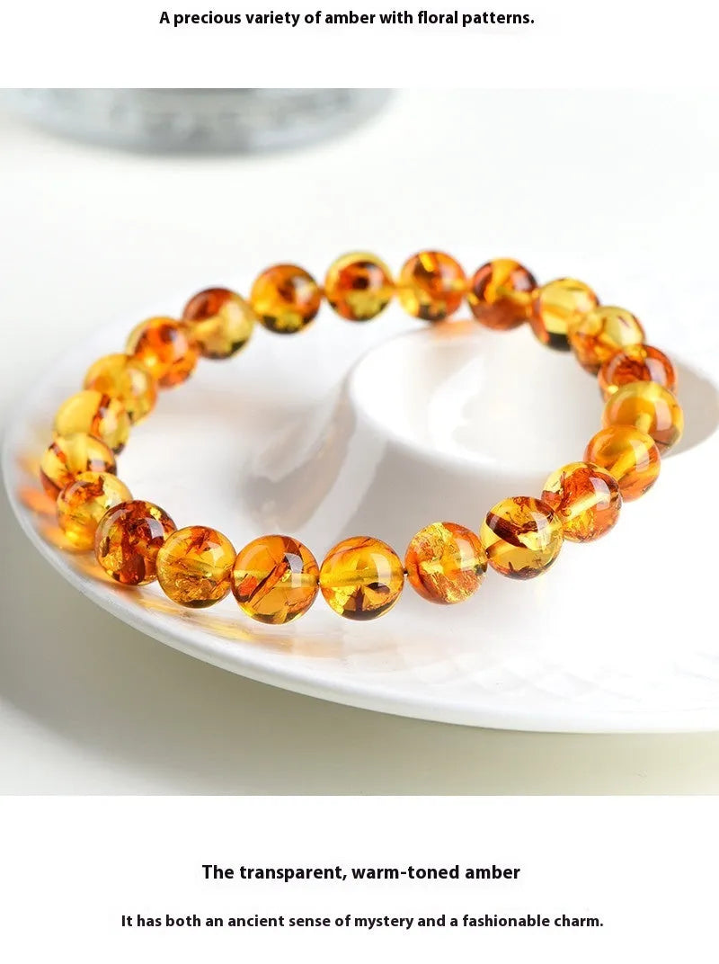 Natural yellow piebald amber bracelet with 7-10mm geometric beads on wrist