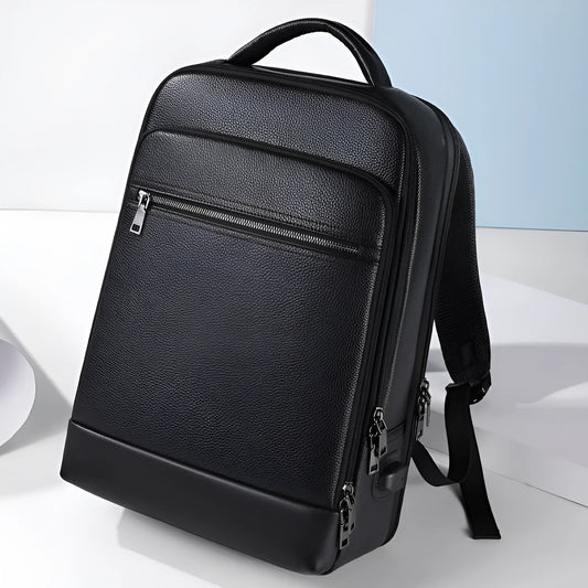 Black genuine leather men's business backpack with curved shoulder straps and sewing line detailing