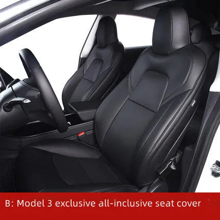 Black PVC seat cover installed on a Tesla Model 3 front seat, showing binding-style edges.