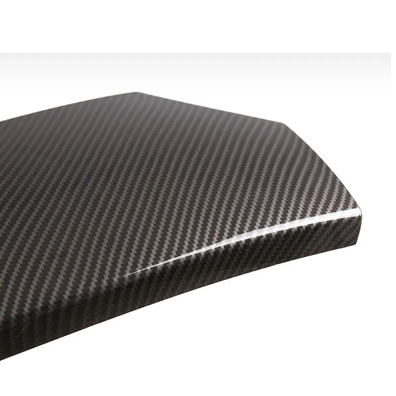 Set of three black ABS plastic armrest box covers with a shiny carbon fibre weave pattern.