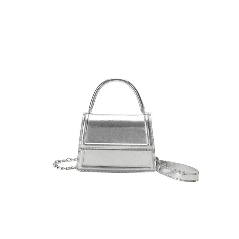 Retro style square PU leather crossbody bag in multiple colours on a model.