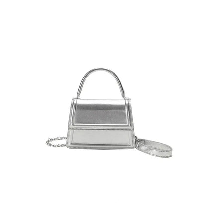 Retro style square PU leather crossbody bag in multiple colours on a model.