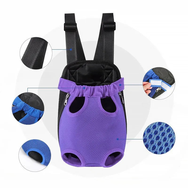 A small dog in a front-worn nylon carrier backpack with mesh panels, adjustable straps and side zips.